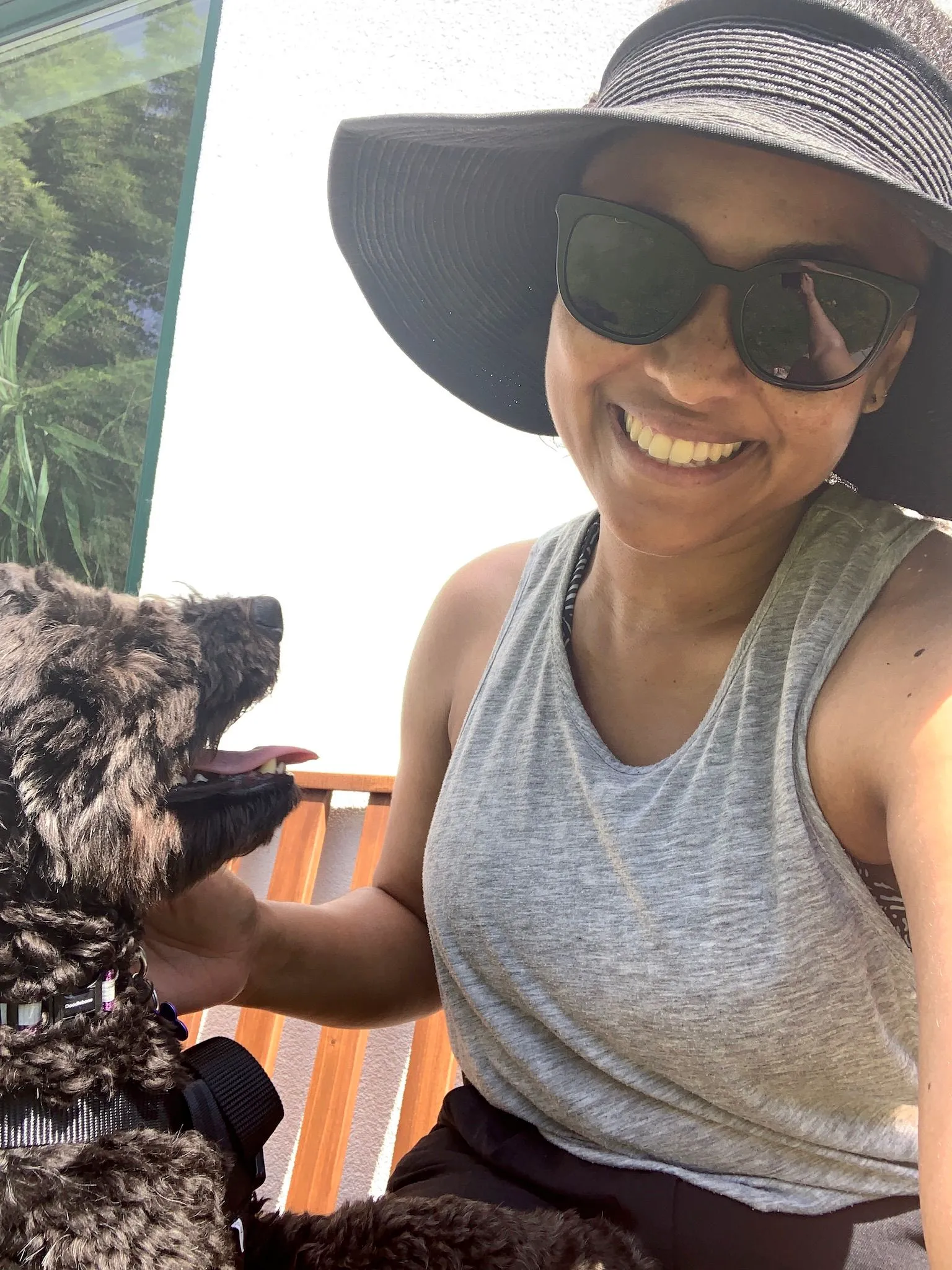 woman and dog in the sun